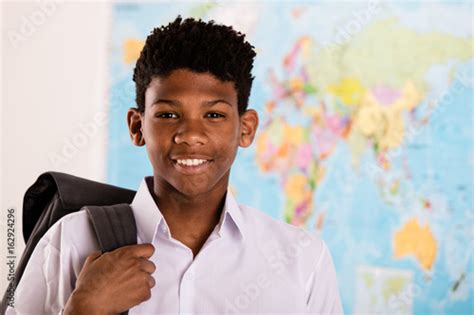 African Boy In His School Uniform And Backpack Stock Photo And