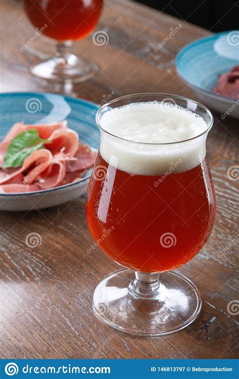 Since our founding, montucky cold snacks has been on a mission to provide a refreshing beer beer and sprinkle a lil' magic on our local communities. Close Up View On Cold Amber Beer In A Glass With Snack At Bar On Table. Bar Image Cocnept With ...