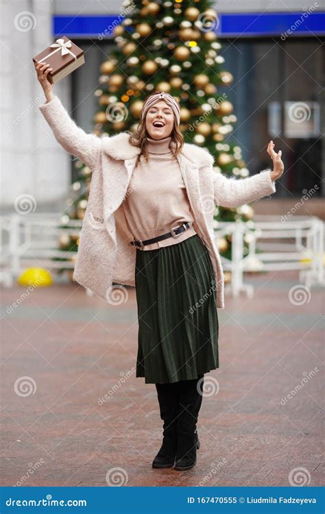 Happy Young Woman Holding A T On A Christmas Market Time To Give