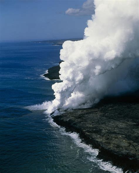 Steam Rising As Molten Lava Meets The Ocean Photograph By G Brad Lewis