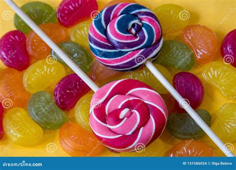 Colorful Lollipops And Different Colored Round Candy Top View Stock