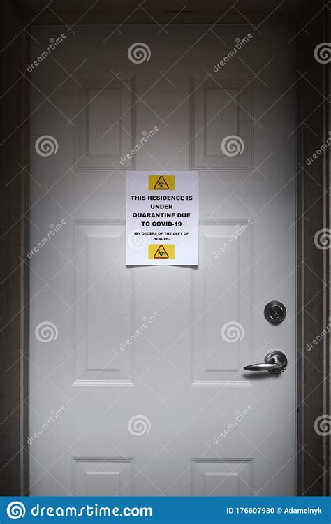 A Self Isolating Residence With A Quarantine Sign On The Front Door