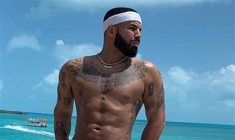 Drake Shows Off His Sculpted Abs As He Goes Shirtless In Fear Of God X Nike Shorts While On