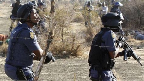 south african police open fire on striking miners cbc news