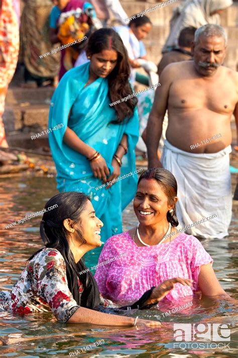indian hindu pilgrims bathing in the ganges river at dashashwamedh ghat in holy city of varanasi
