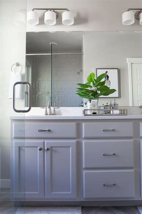 It makes the room feel modern and fresh and lets the wooden vanities remain the. Grey Painted Bathroom Cabinets with Satin Nickel Pulls ...