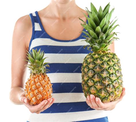 Premium Photo Woman Holding Pineapples Isolated On White
