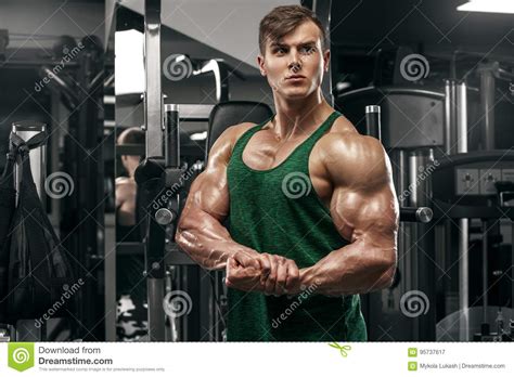 Muscular Man Showing Muscles Working Out In Gym Strong Male With Big
