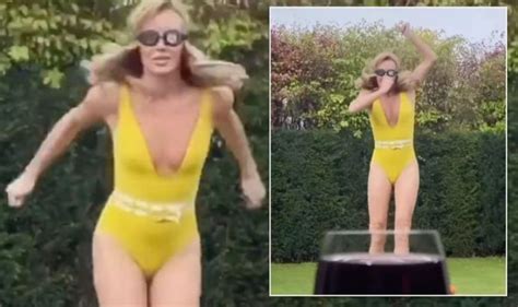 Amanda Holden BGT Star Flaunts Figure In Yellow Swimsuit As She Jumps Into Glass Of Wine