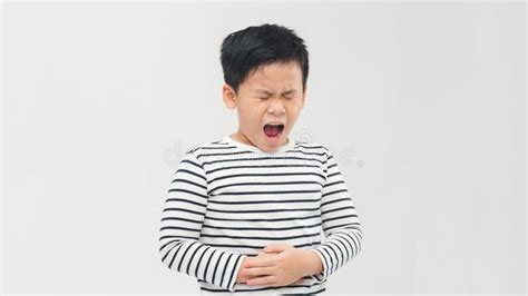 Little Boy Suffering From Stomach Ache Isolated On White Stock Photo
