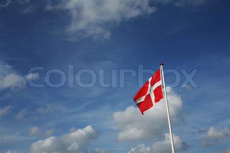 The regional flags of bornholm and ærø are known to be in active use. Danish flag in the wind with blue sky | Stock image | Colourbox