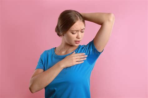 Young Woman With Sweat Stain On Her Clothes Pink Background Using