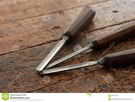 Carpenter Wood Chisel Tools On Old Weathered Workbench Stock Photo