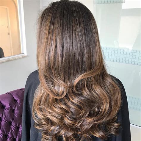 Classic Curls At The Ends Of Long Layers While The Weightiness Of