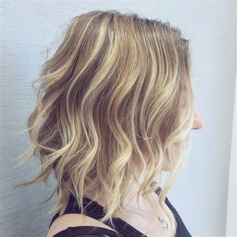 Long, shaggy tendrils parted in the center are a great way to rock your natural, wavy hair. 10 Latest Medium Wavy Hair Styles for Women: Shoulder ...