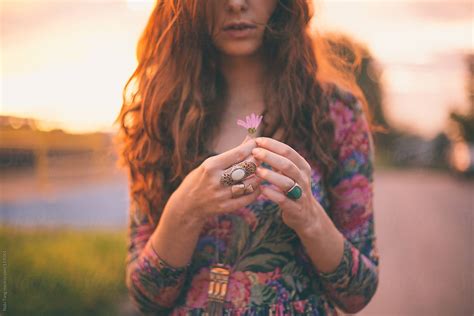 Pretty Girl In Floral Dress Holding The Flower At Sunset By Stocksy Contributor Nabi Tang