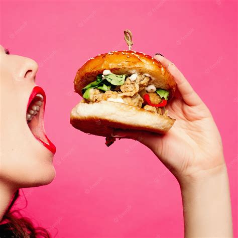 Premium Photo Hungry Woman With Opened Mouth Eating Big Hamburger