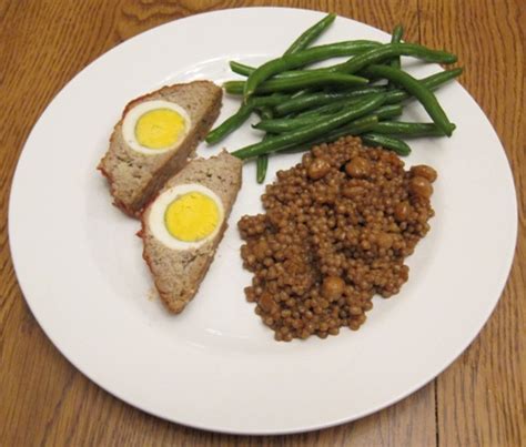 Transfer meatloaf to platter and cut into slices to. Dinner Of Stuffed Meatloaf With Egg, Green Beans And ...