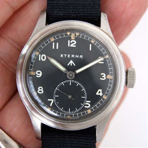 A watch face that has a black base colour which helps to define the white numbering. c1943 Rare Eterna "Dirty Dozen" WWW British Army Issued ...