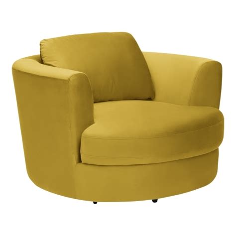 The chair rests on four wooden legs which taper don and have a contrasting silver finish. Mustard Velvet Magnolia Swivel Armchair | Modern Swivel Chairs