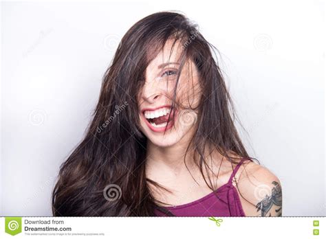 Goofy Young Woman Making Silly Face Sticking Tongue Out And Laug Stock