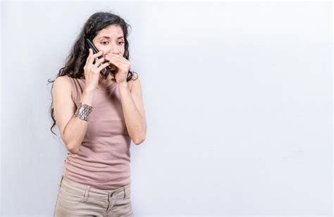 Premium Photo Mysterious Young Woman Talking On The Phone Isolated