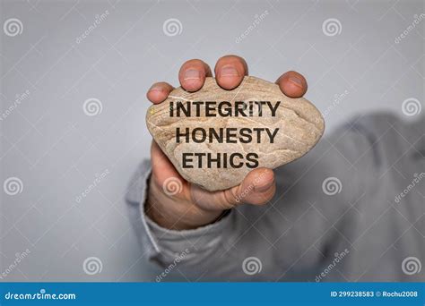 Honesty And Integrity Symbol Businessman Holds In His Hand A Stone
