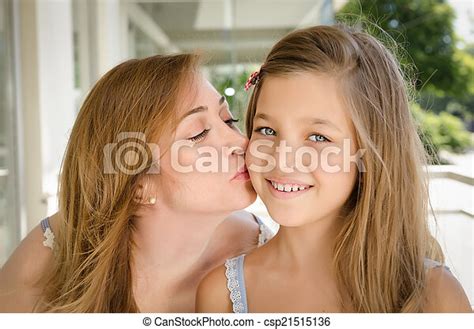 Stock Photos Of Mother Kissing Her Daughter In The Cheek Taken In