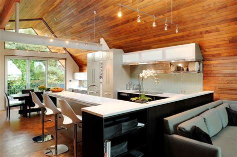 These days wood paneling can be reinvented into something modern and not the least bit dowdy. Kitchen with Wooden Walls and Ceiling