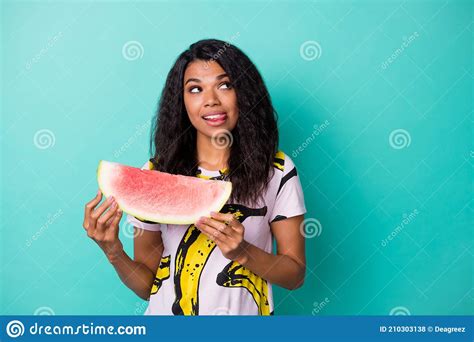 Photo Of Inspired Girl Look Empty Space Hold Watermelon Lick Tongue Lips Think Isolated Over