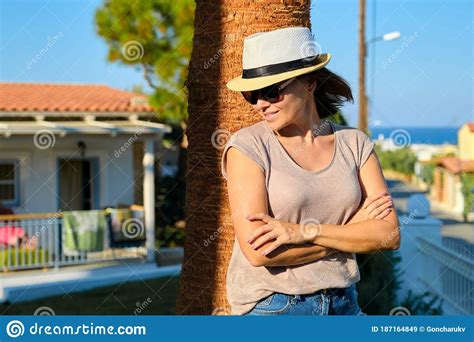 portrait of mature beautiful smiling woman on vacation summer tropical landscape stock image