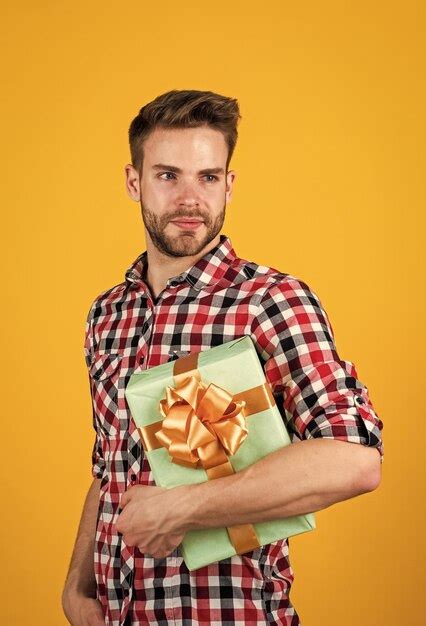 Premium Photo Male With Fashionable Groomed Hair And Beard Hold Box Present