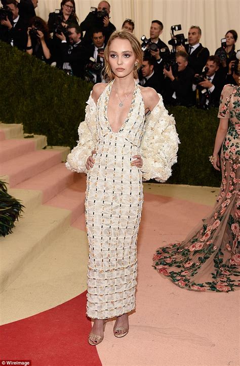 Lily Rose Depp Makes Met Gala Debut In Plunging White Gown Daily Mail Online