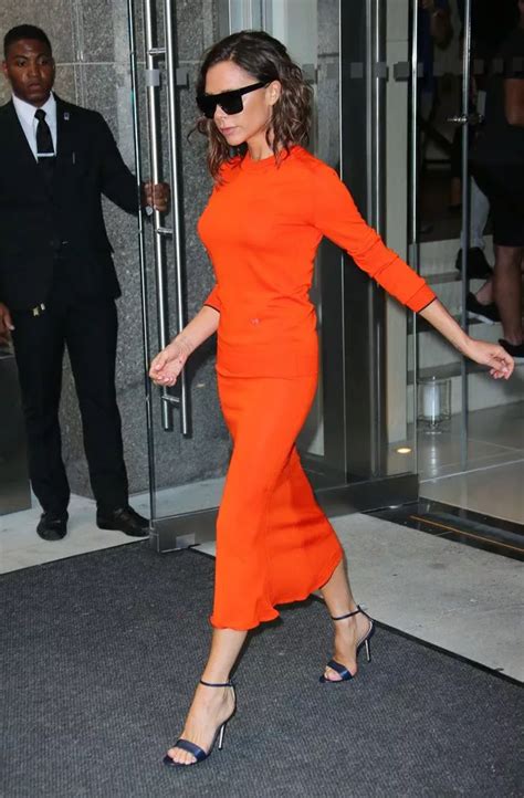 Victoria Beckham Is Glowing In Bright Orange Dress Following New York Fashion Week Show Success