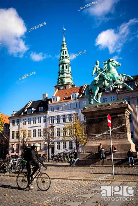 Denmark Cyclist Passing In Front Of Bishop Absalon Statue Copenhagen