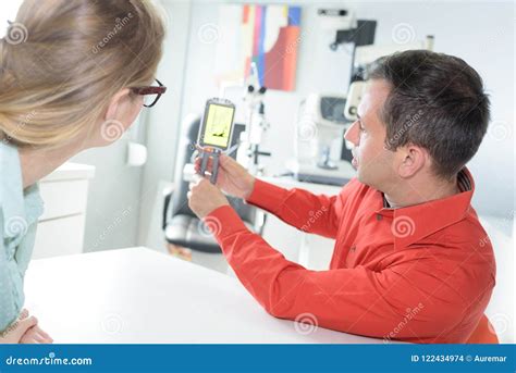 Medical Salesman Showing Device To Doctor Stock Photo - Image of