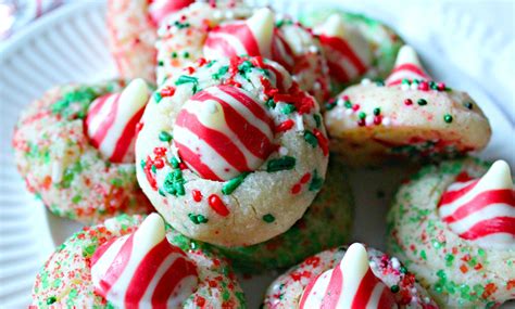 Align pretzels on cookie sheet in a single layer then top each pretzel with one hershey's hug chocolate. Hershey Candy Cane Kiss Cookies - Perfect for the Holidays ...
