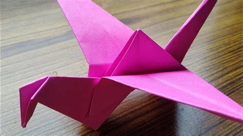 Fold the corners in toward the center crease and then unfold. How to make a origami flapping bird step by step/without ...