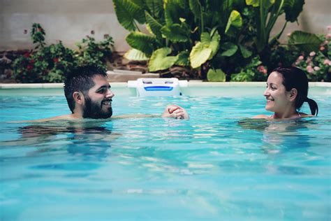 Couple In Love Enjoying In A Swimming Pool In Summer Photograph By