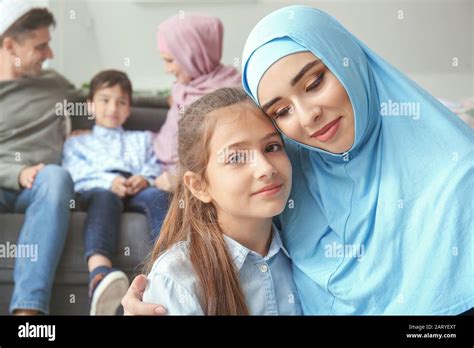Portrait Of Happy Muslim Woman With Daughter At Home Stock Photo Alamy