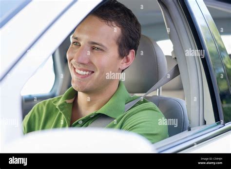 Smiling Mid Adult Man Driving A Car Stock Photo Alamy