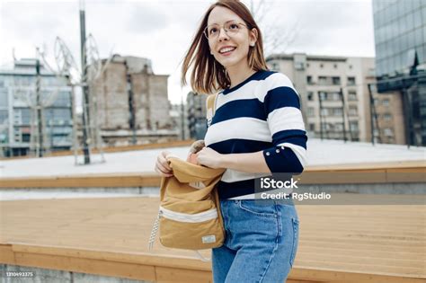 Portrait Of A Happy Beautiful Student Going To College Stock Photo