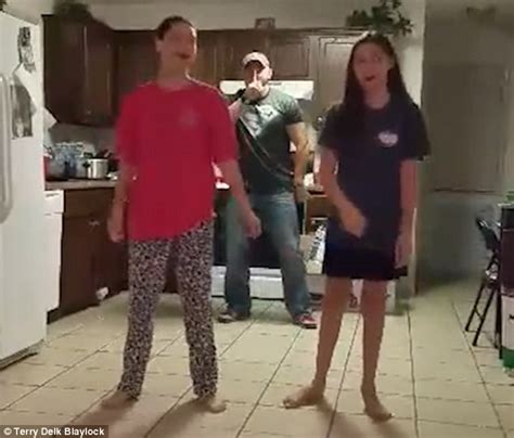 father of two girls practising the whip nae nae sneaks up behind them in video daily mail online