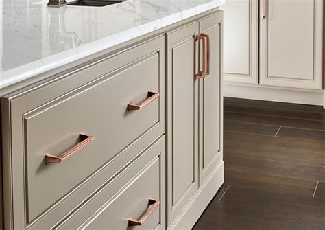 When refacing kitchen cabinets, upper and lower cabinet boxes stay in place instead of being dumped in a landfill; Top Tips for Your Kitchen Cabinet Refacing Painting Project