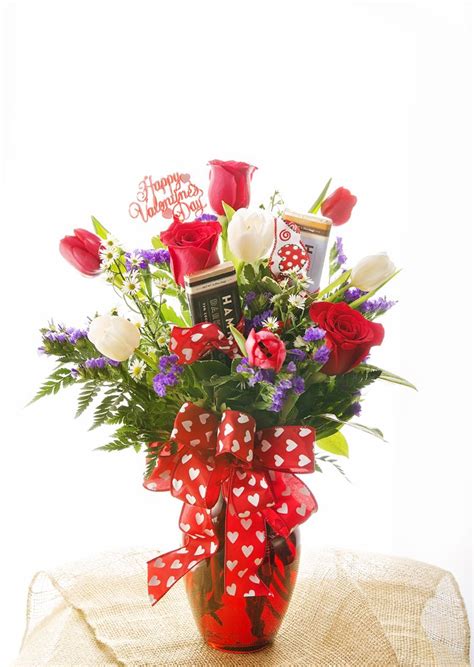 Blooms of yellow and white are loosely gathered with lush greenery inside a clear cylinder vase. Send a sweet surprise her way today! | Flower delivery ...
