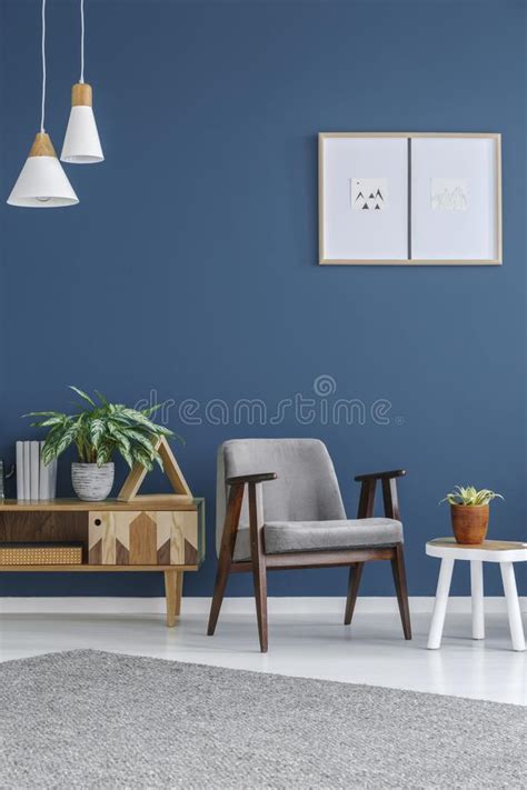 We make them to order so you can choose leather or fabric upholstery to suit your decor. Grey Armchair With Wooden Frame Stock Image - Image of ...