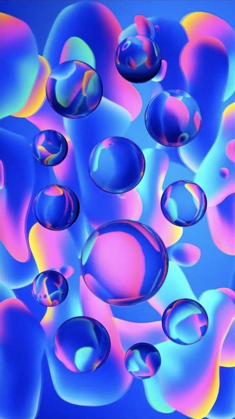 An Image Of Colorful Bubbles Floating In The Air With Blue And Pink