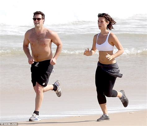 justin bartha and fiancée lia smith are off to a running start as they show off their beach