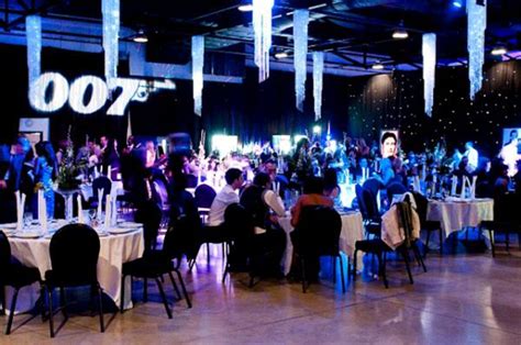 Dinner surrounded by james bond theme night backdrops, props and theming a cabaret act featuring a bond girls dance act and shirley bassey tribute act; Prego Events James Bond Themed Event
