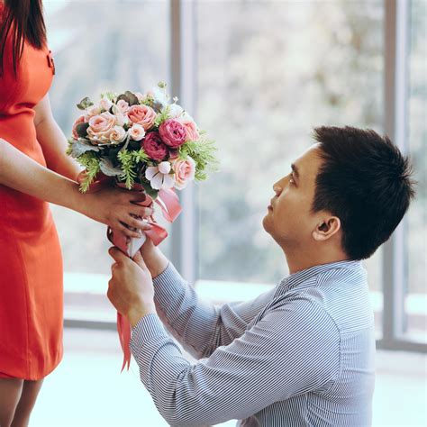 Adult Asian Man Give A Flower Bouquet To Girlfriend In Romantic Date